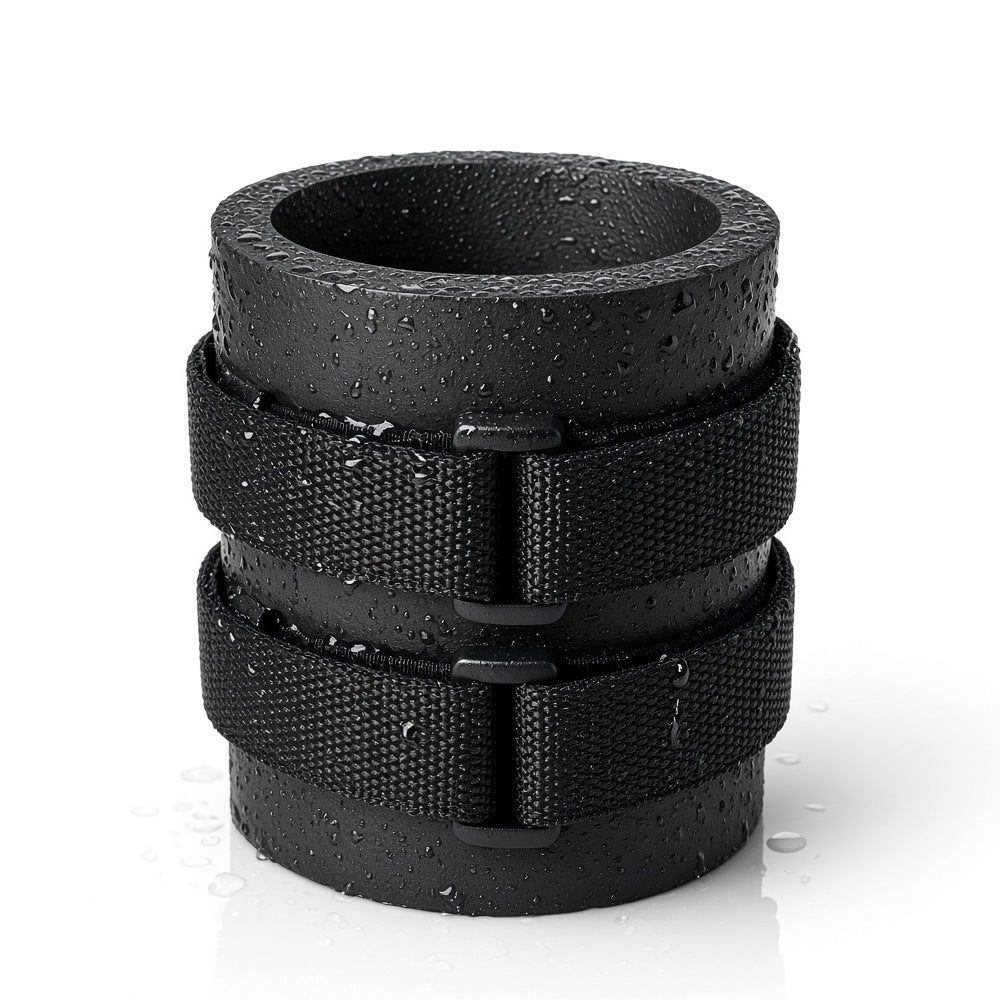 Black Beer Binding PRO beer holder, empty and beaded with water droplets: a thick foam sleeve with heavy-duty webbing straps that mount it to ski poles, ski boots, snowboard bindings and bikes.