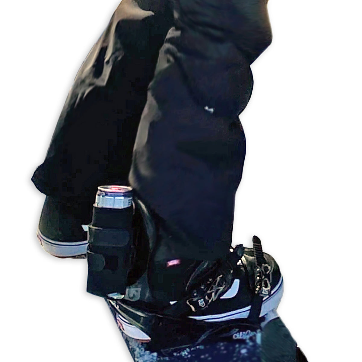 Black beer can holder strapped to a snowboard boot, holding a tall slim can.